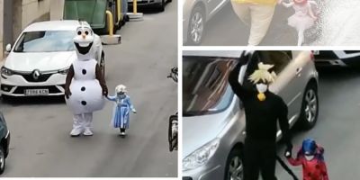 Pai e filha usam fantasias para levar lixo durante o isolamento na Espanha